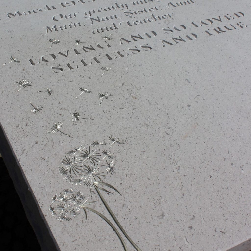 flower carving on bespoke gravestone